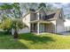 Charming home with well-kept lawn, inviting turquoise front door, and a fenced in yard at 237 Chesapeake Ln., Murrells Inlet, SC 29576