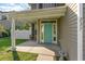 Inviting front porch and a turquoise front door entrance to the home's exterior at 237 Chesapeake Ln., Murrells Inlet, SC 29576