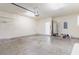 Spacious garage featuring concrete flooring, white walls, and a hot water tank at 237 Chesapeake Ln., Murrells Inlet, SC 29576