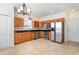 Well-lit kitchen featuring stainless steel appliances, granite countertops and wood cabinets at 237 Chesapeake Ln., Murrells Inlet, SC 29576