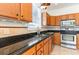 This kitchen boasts granite countertops, stainless appliances, tile backsplash and wood cabinets at 237 Chesapeake Ln., Murrells Inlet, SC 29576