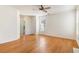 Spacious living room with hardwood floors, ceiling fan, and ample natural light at 237 Chesapeake Ln., Murrells Inlet, SC 29576