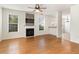 Open-concept living room with a fireplace and hardwood floors at 237 Chesapeake Ln., Murrells Inlet, SC 29576
