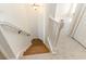View looking down a carpeted stairway with wood steps and white railings and trim at 237 Chesapeake Ln., Murrells Inlet, SC 29576