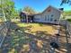 Spacious backyard featuring a screened-in porch, fenced-in yard, and lush greenery at 2488 Oriole Dr., Murrells Inlet, SC 29576
