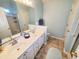 Bathroom features a double vanity, tiled floors, and glass-enclosed shower at 2488 Oriole Dr., Murrells Inlet, SC 29576