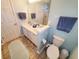 Clean bathroom with double vanity, light blue walls, and tiled floors at 2488 Oriole Dr., Murrells Inlet, SC 29576