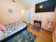 Comfortable bedroom with wood floors, a TV, and light orange walls at 2488 Oriole Dr., Murrells Inlet, SC 29576