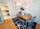 Coastal dining room with light blue walls, wood dining table, bench, and accent rug at 2488 Oriole Dr., Murrells Inlet, SC 29576