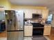 Bright kitchen featuring stainless appliances, ample cabinetry, and eat-in dining space at 2488 Oriole Dr., Murrells Inlet, SC 29576
