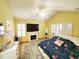 Bright main bedroom with a flamingo-themed bedspread, fireplace, and natural light at 2488 Oriole Dr., Murrells Inlet, SC 29576