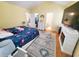 Spacious bedroom with a flamingo-themed bedspread, fireplace, and ensuite bathroom at 2488 Oriole Dr., Murrells Inlet, SC 29576