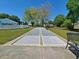Outdoor shuffleboard courts surrounded by well-manicured lawns and mature trees at 2488 Oriole Dr., Murrells Inlet, SC 29576