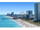 Aerial beach view featuring high rises, a ferris wheel, and vacationers along the shoreline at 255 Augusta Green Way, Myrtle Beach, SC 29579