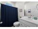 Neutral bathroom featuring a toilet, sink, and a blue shower curtain for a splash of color at 255 Augusta Green Way, Myrtle Beach, SC 29579