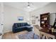 Bright bedroom featuring a blue sofa, ceiling fan, work space and large window for natural light at 255 Augusta Green Way, Myrtle Beach, SC 29579