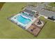 Community pool featuring lounge chairs, a playground, picnic tables and parking spots surrounded by grass at 255 Augusta Green Way, Myrtle Beach, SC 29579