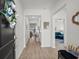 Inviting entryway with wood floors leading to a living area featuring an open floor plan at 255 Augusta Green Way, Myrtle Beach, SC 29579