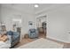 Comfortable seating area with ceiling fan and a view into kitchen with stainless appliances at 255 Augusta Green Way, Myrtle Beach, SC 29579