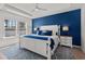 Main bedroom with natural light, tray ceiling, and a stylish accent wall at 255 Augusta Green Way, Myrtle Beach, SC 29579