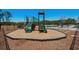 Community playground equipment featuring a slide, climbing apparatus, and landscaped wood chip ground cover at 255 Augusta Green Way, Myrtle Beach, SC 29579