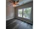 Bedroom with hardwood floors and large windows providing plenty of natural light at 2601 Sand Dunes Dr., Myrtle Beach, SC 29577