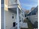 Exterior shot featuring a balcony that overlooks a small yard, showcasing the property's outdoor space at 2601 Sand Dunes Dr., Myrtle Beach, SC 29577