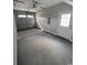 Spacious garage featuring a garage door, and an entrance door at 2601 Sand Dunes Dr., Myrtle Beach, SC 29577