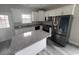 Modern kitchen with stainless steel appliances, granite countertops, and an island at 2601 Sand Dunes Dr., Myrtle Beach, SC 29577