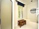 Bright bathroom with a window view, shower, and a soaking tub at 273 Golden Bear Dr. # F3, Pawleys Island, SC 29585