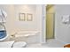 Bright bathroom features a soaking tub and separate glass shower at 273 Golden Bear Dr. # F3, Pawleys Island, SC 29585