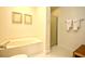 Bathroom featuring a soaking tub, shower, and soft lighting at 273 Golden Bear Dr. # F3, Pawleys Island, SC 29585