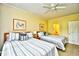 Bedroom with two beds, ceiling fan, and access to an adjacent bathroom at 273 Golden Bear Dr. # F3, Pawleys Island, SC 29585