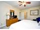 Relaxing bedroom showcases a king bed, ceiling fan, and an ensuite bathroom at 273 Golden Bear Dr. # F3, Pawleys Island, SC 29585