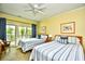Bedroom with two beds, a ceiling fan, and a sliding glass door leading to a deck at 273 Golden Bear Dr. # F3, Pawleys Island, SC 29585