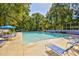 Inviting community pool with blue umbrellas and lounge chairs, perfect for relaxation and recreation at 273 Golden Bear Dr. # F3, Pawleys Island, SC 29585