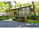 Charming two-story home with meticulous landscaping, mature greenery, and inviting curb appeal at 273 Golden Bear Dr. # F3, Pawleys Island, SC 29585