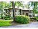 Traditional two-story home featuring symmetrical design and lush landscaping at 273 Golden Bear Dr. # F3, Pawleys Island, SC 29585