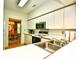 Bright kitchen with white cabinets and stainless steel microwave at 273 Golden Bear Dr. # F3, Pawleys Island, SC 29585