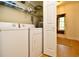 Laundry room with a washer, dryer, shelving, and access to the rest of the house at 273 Golden Bear Dr. # F3, Pawleys Island, SC 29585