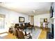 Charming living room with a fireplace, comfortable seating, and a bar area visible through the wall at 273 Golden Bear Dr. # F3, Pawleys Island, SC 29585