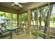 Enjoy outdoor dining on the screened porch with views of the lush, green golf course at 273 Golden Bear Dr. # F3, Pawleys Island, SC 29585