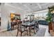 Elegant dining room featuring a coffered ceiling, wood flooring, and stylish furnishings at 296 Switchgrass Loop, Little River, SC 29566