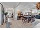 Elegant dining room featuring a coffered ceiling, wood flooring, and stylish furnishings at 296 Switchgrass Loop, Little River, SC 29566
