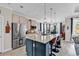Spacious kitchen with stainless steel appliances, large island, and stylish pendant lighting at 296 Switchgrass Loop, Little River, SC 29566