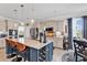 Bright, open kitchen featuring a large island, modern appliances, and bar seating at 296 Switchgrass Loop, Little River, SC 29566