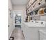 Functional laundry room with modern appliances, ample storage, and convenient access to the home at 296 Switchgrass Loop, Little River, SC 29566