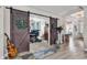 Unique living space with barn doors leading to a music room, adding character and charm at 296 Switchgrass Loop, Little River, SC 29566