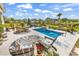Inviting pool area with lounge chairs, landscaping, and tranquil water features at 296 Switchgrass Loop, Little River, SC 29566
