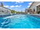 Sparkling swimming pool with tranquil waterfall feature and a backyard view at 296 Switchgrass Loop, Little River, SC 29566